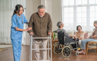 young asian female nurse care giver helping asian senior old man with mobility walker living area nursing home senior daycare center nurse take care elderly patient with cheerful concentrate